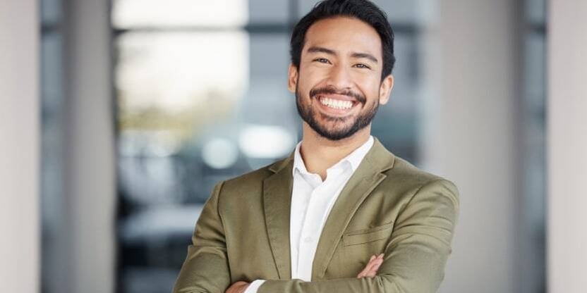 A man smiles at the camera