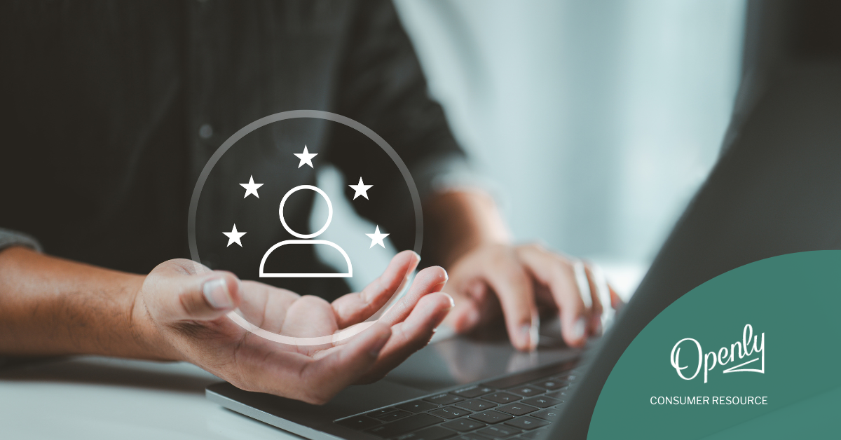 A hand holds is open on a laptop holding a superimposed icon of a person surrounded by 5 stars.