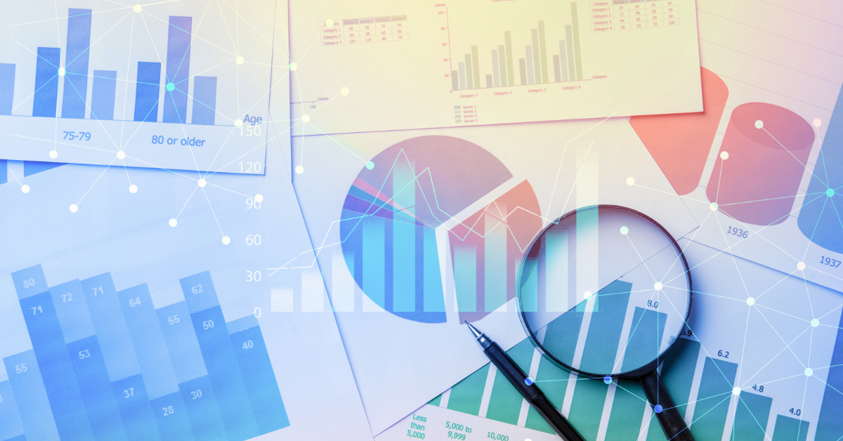A collection of printed data charts and graphs, including a pie chart and bar graphs, overlaid with a digital network graphic of connected nodes. A magnifying glass and a pen rest on top of the documents.